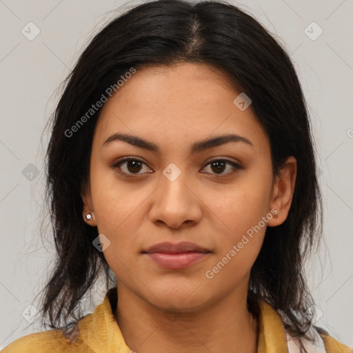 Joyful latino young-adult female with long  brown hair and brown eyes