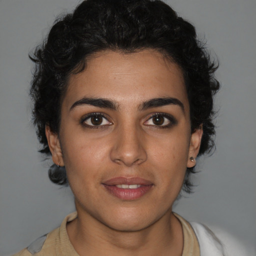 Joyful latino young-adult female with short  brown hair and brown eyes