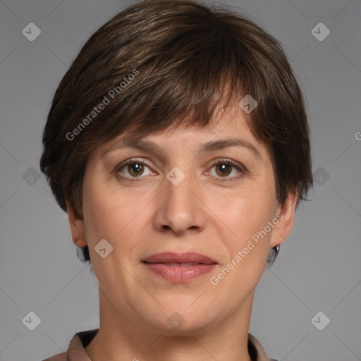 Joyful white adult female with short  brown hair and brown eyes