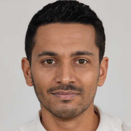 Neutral latino young-adult male with short  black hair and brown eyes