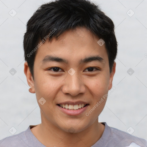 Joyful asian young-adult male with short  brown hair and brown eyes