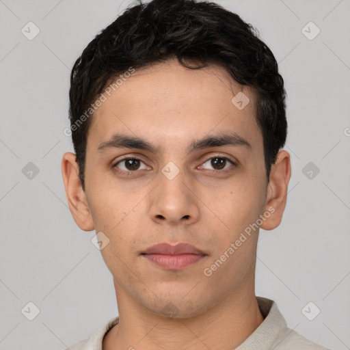 Neutral white young-adult male with short  black hair and brown eyes