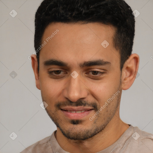 Joyful latino young-adult male with short  black hair and brown eyes