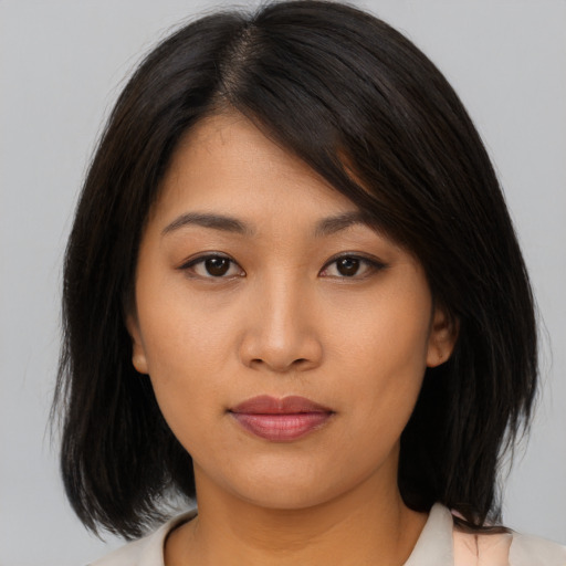 Neutral asian young-adult female with medium  brown hair and brown eyes