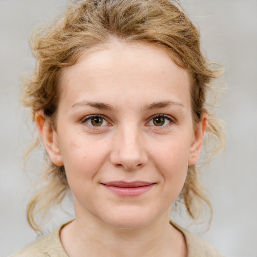 Joyful white young-adult female with medium  brown hair and blue eyes