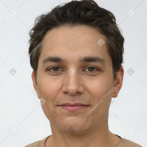 Joyful white adult male with short  brown hair and brown eyes