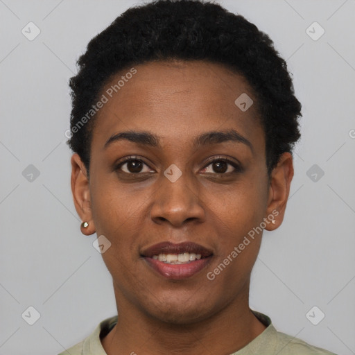 Joyful black young-adult female with short  black hair and brown eyes