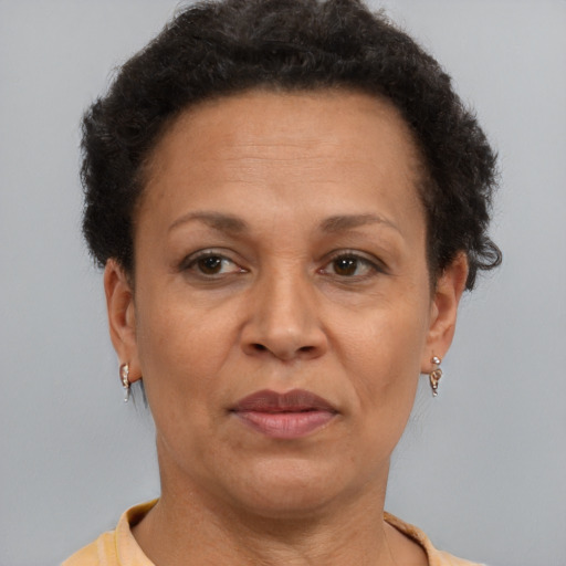 Neutral latino adult female with short  brown hair and brown eyes