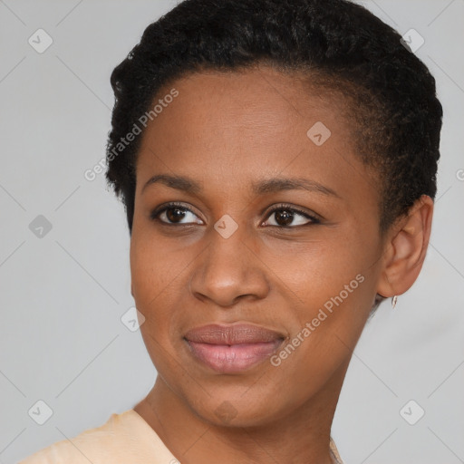 Joyful black young-adult female with short  brown hair and brown eyes