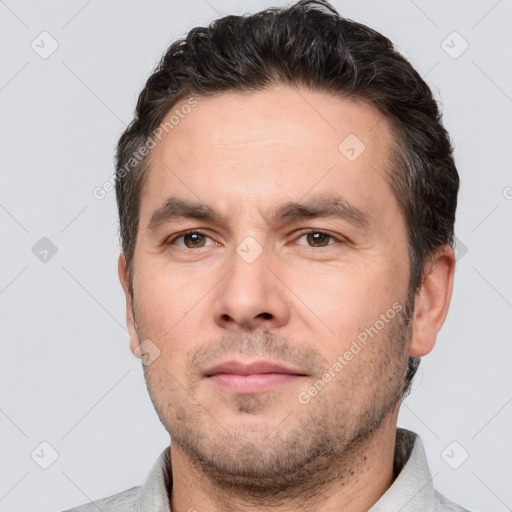 Neutral white adult male with short  brown hair and brown eyes