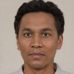 Neutral black adult male with short  black hair and brown eyes
