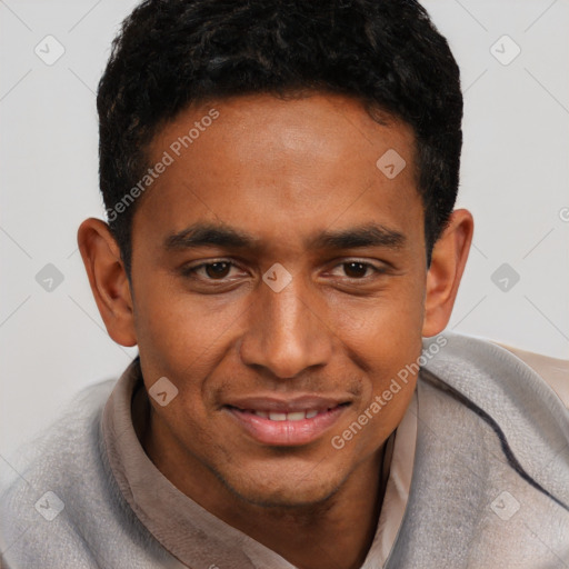 Joyful black young-adult male with short  black hair and brown eyes