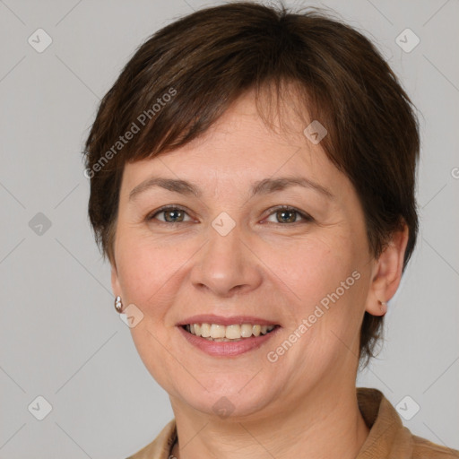 Joyful white adult female with medium  brown hair and grey eyes