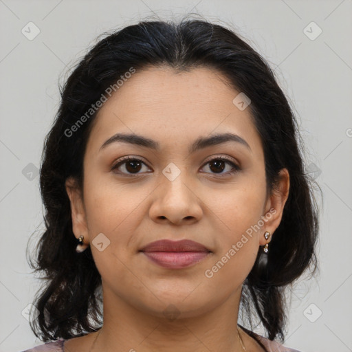 Joyful latino young-adult female with medium  brown hair and brown eyes