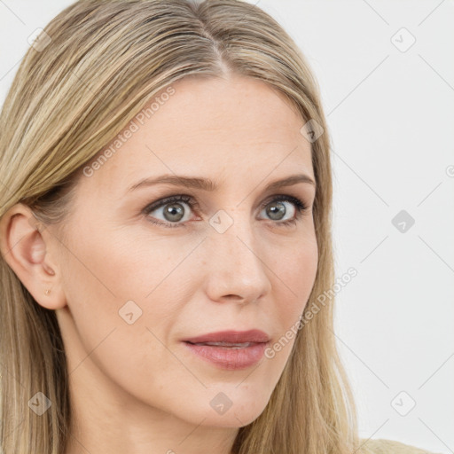 Joyful white young-adult female with long  brown hair and blue eyes