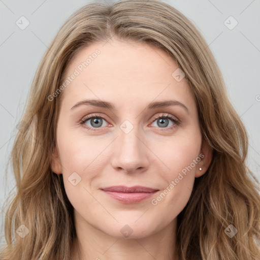 Joyful white young-adult female with long  brown hair and blue eyes