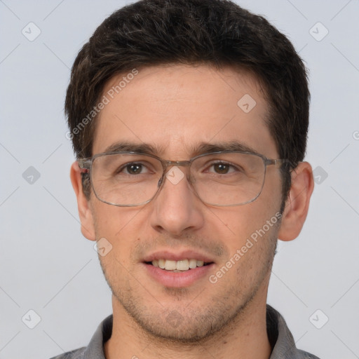 Joyful white adult male with short  brown hair and brown eyes