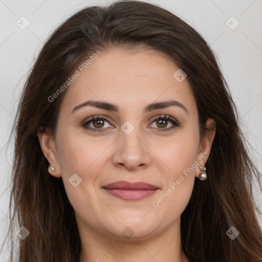 Joyful white adult female with long  brown hair and brown eyes