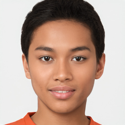 Joyful latino young-adult male with short  brown hair and brown eyes