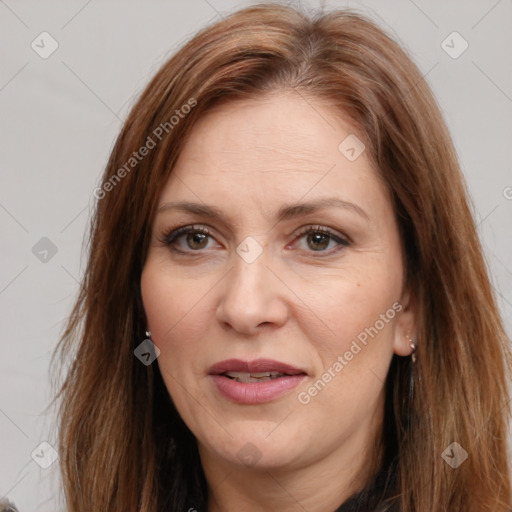 Joyful white adult female with long  brown hair and brown eyes