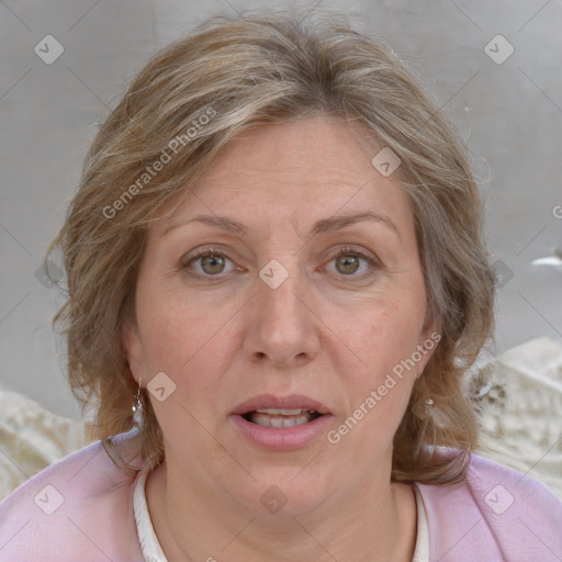 Joyful white adult female with medium  brown hair and grey eyes