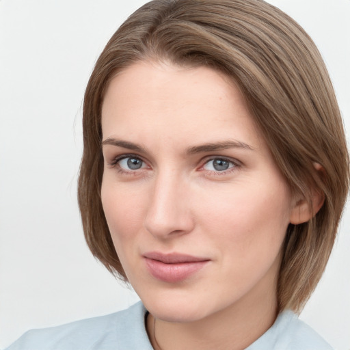 Neutral white young-adult female with medium  brown hair and grey eyes