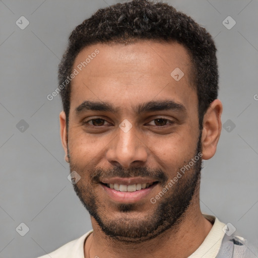 Joyful white young-adult male with short  black hair and brown eyes