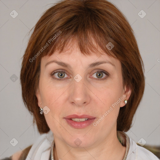 Joyful white adult female with medium  brown hair and blue eyes