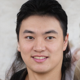 Joyful white young-adult male with medium  brown hair and brown eyes