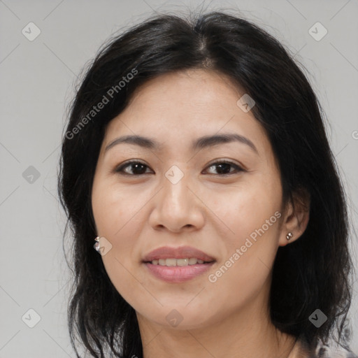 Joyful asian young-adult female with long  brown hair and brown eyes