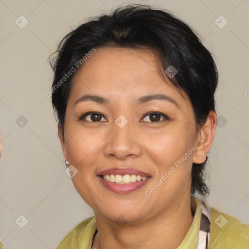 Joyful latino young-adult female with medium  brown hair and brown eyes