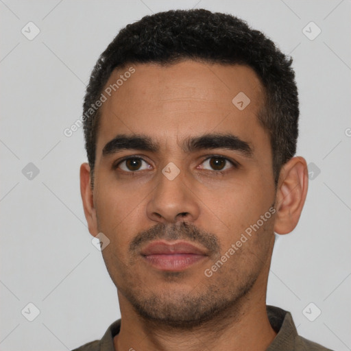 Neutral latino young-adult male with short  black hair and brown eyes