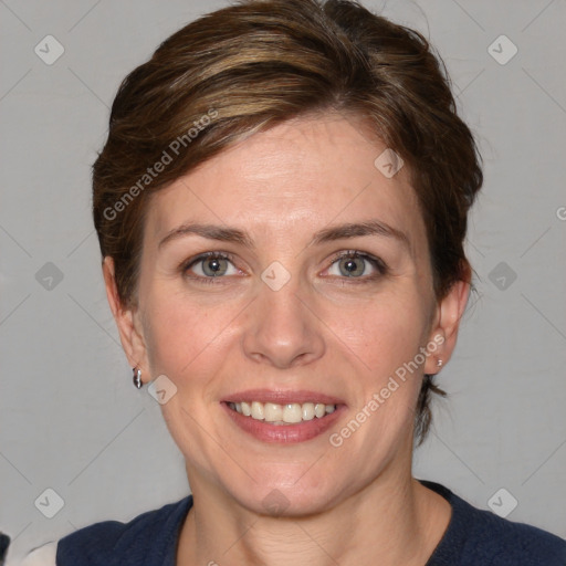 Joyful white adult female with medium  brown hair and blue eyes