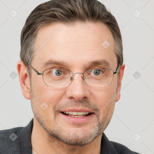 Joyful white adult male with short  brown hair and grey eyes