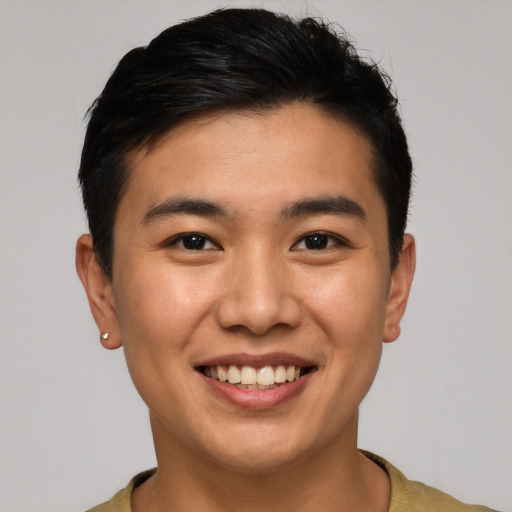 Joyful asian young-adult male with short  brown hair and brown eyes