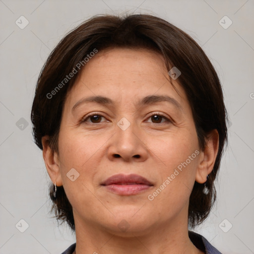 Joyful white adult female with medium  brown hair and brown eyes