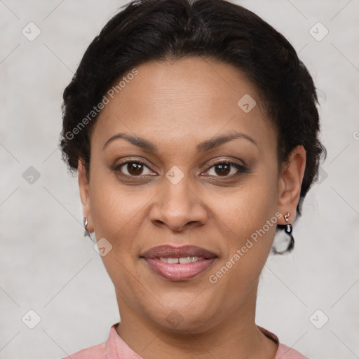 Joyful latino adult female with short  brown hair and brown eyes