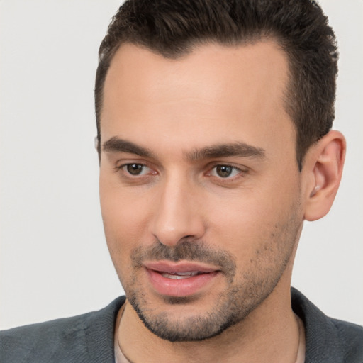 Joyful white young-adult male with short  brown hair and brown eyes