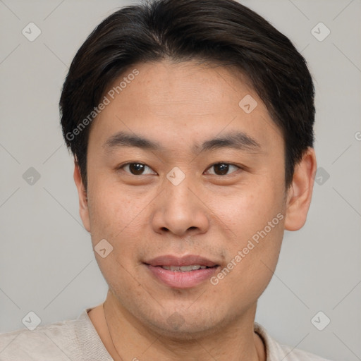 Joyful asian young-adult male with short  brown hair and brown eyes