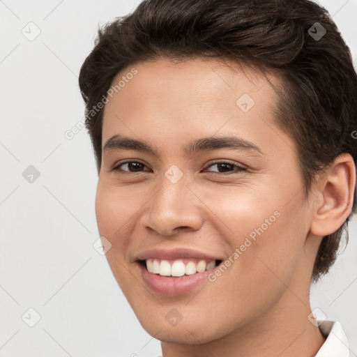 Joyful white young-adult female with short  brown hair and brown eyes