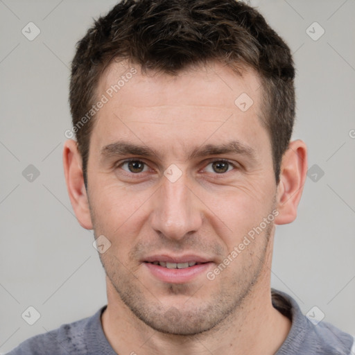 Joyful white adult male with short  brown hair and brown eyes