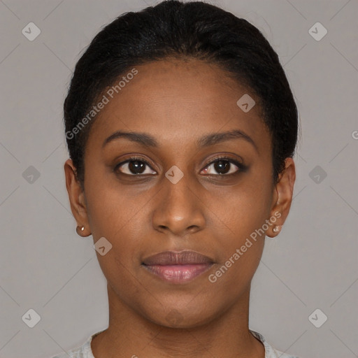 Joyful black young-adult female with short  black hair and brown eyes