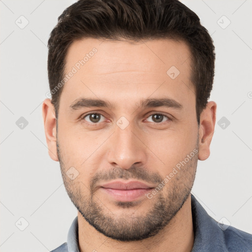 Joyful white young-adult male with short  brown hair and brown eyes