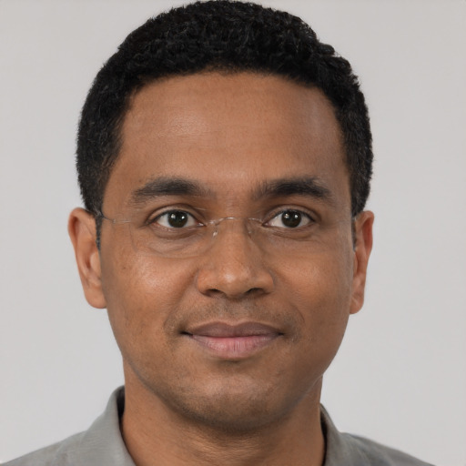 Neutral black young-adult male with short  black hair and brown eyes