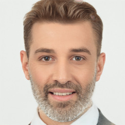 Joyful white adult male with short  brown hair and brown eyes