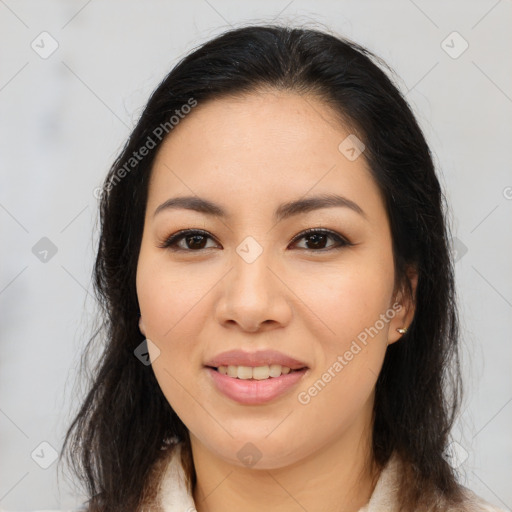 Joyful latino young-adult female with long  brown hair and brown eyes