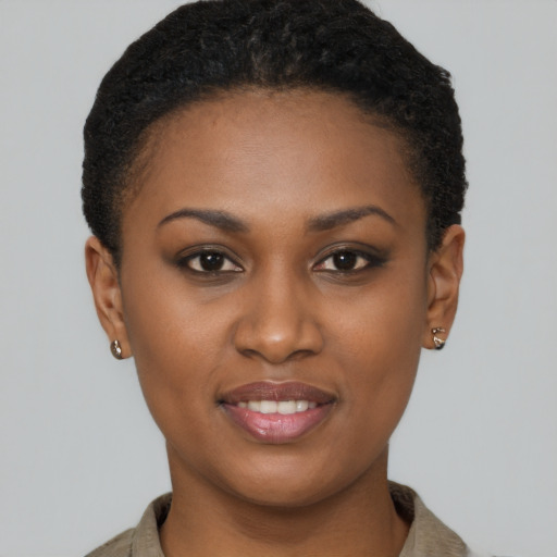 Joyful black young-adult female with short  brown hair and brown eyes