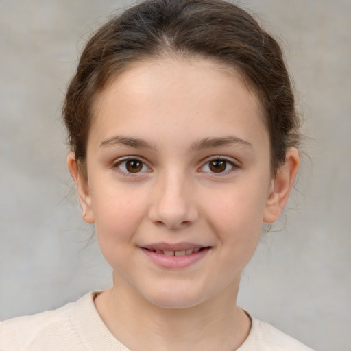 Joyful white child female with short  brown hair and brown eyes