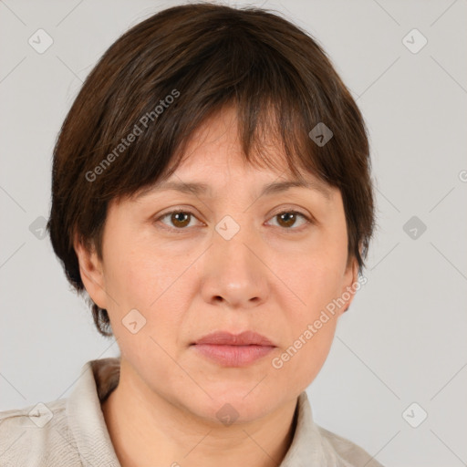 Joyful white adult female with medium  brown hair and brown eyes