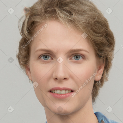 Joyful white young-adult female with short  brown hair and blue eyes